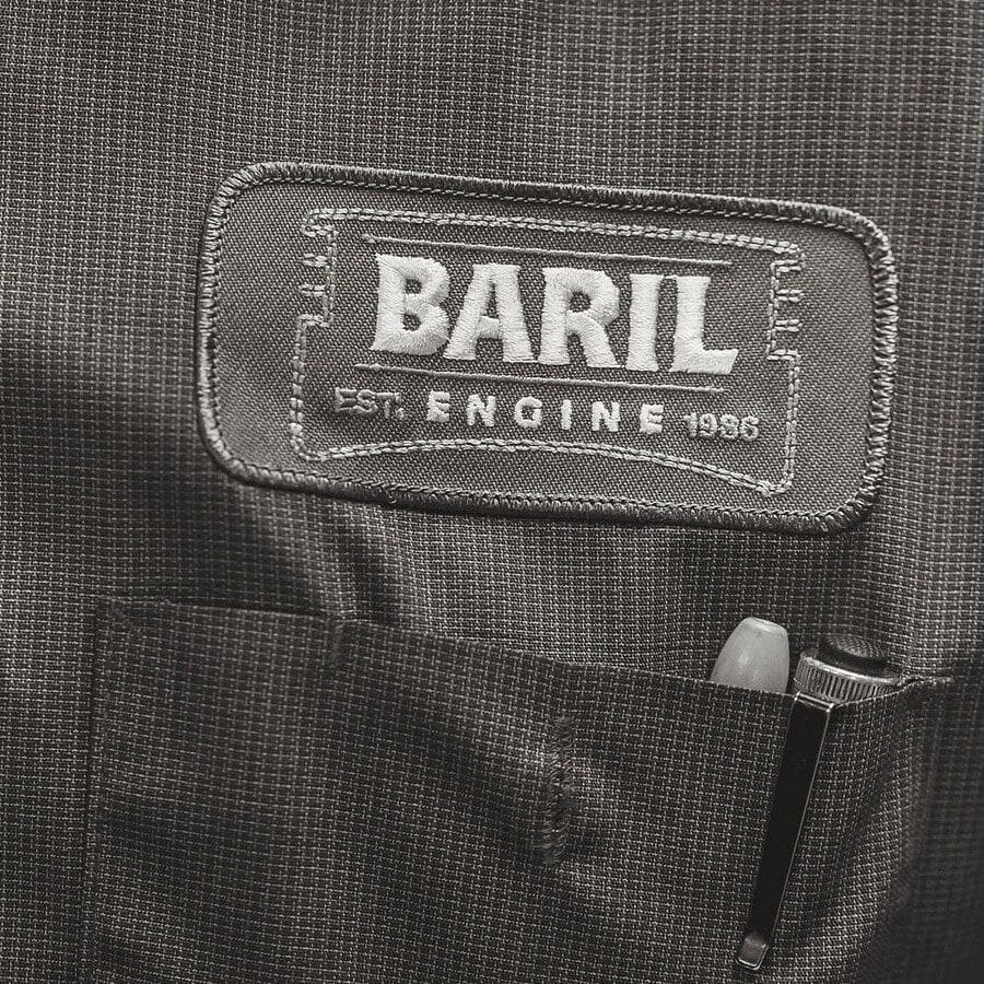 Close-up view of the Baril Engine patch on a machinist's work shirt.